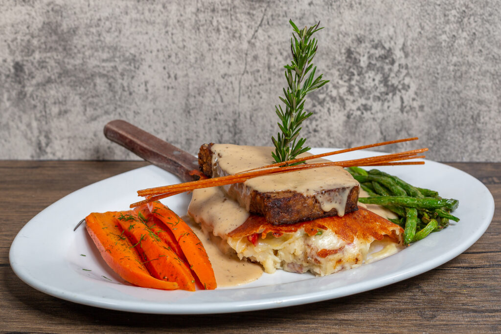 The Ultimate Guide to Comfort Food in Las Vegas at Hash House A Go Go 1 Comfort meatloaf meal with mashed potatoes, vegetables, and gravy served at Hash House A Go Go in Las Vegas