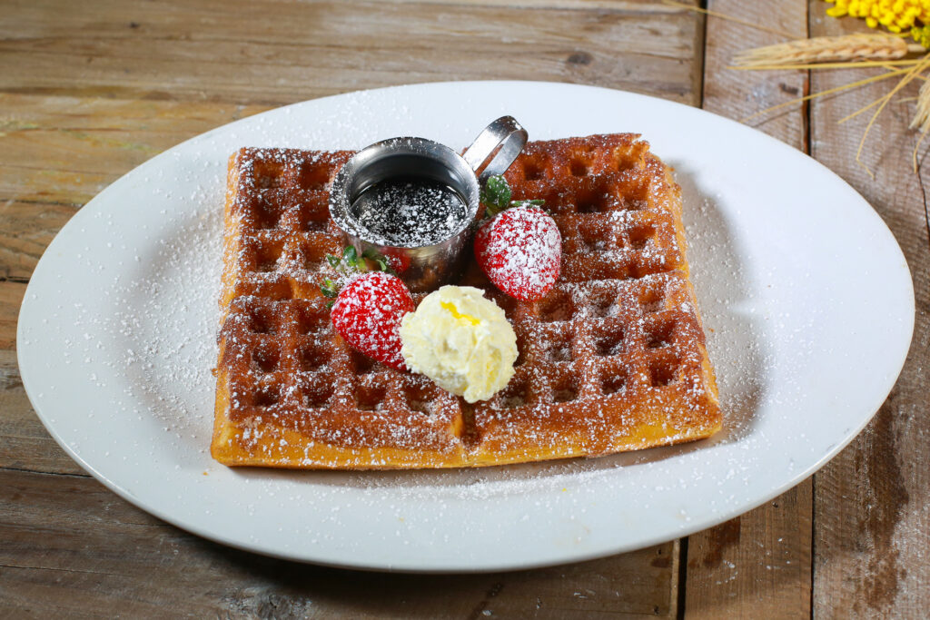 Exploring the Farm-to-Table Experience at Hash House A Go Go West Sahara 2 Belgian waffle with strawberries, whipped butter, and syrup at Hash House A Go Go West Sahara Las Vegas Farm-to-Table Brunch
