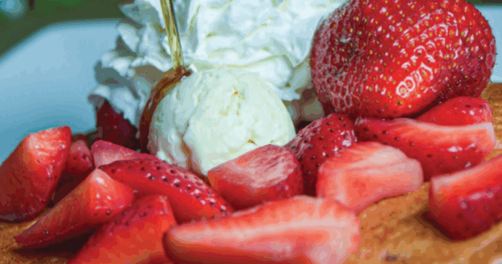 Johnny Hoe 'Cakes topped with whipped cream and strawberries at Hash House A Go Go West Sahara in Las Vegas
