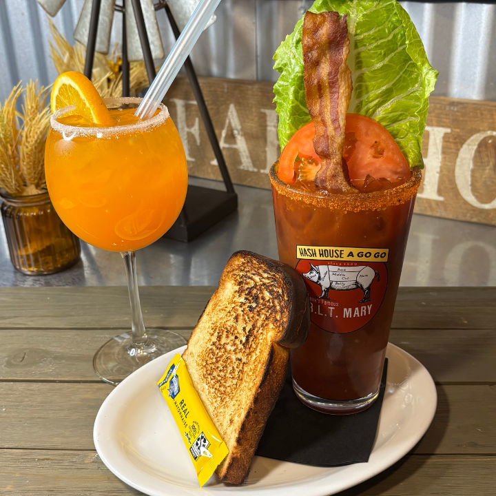 Orange Crush cocktail and Johnny’s Famous B.L.T. Mary with toast, bacon, tomato, and lettuce at Hash House A Go Go
