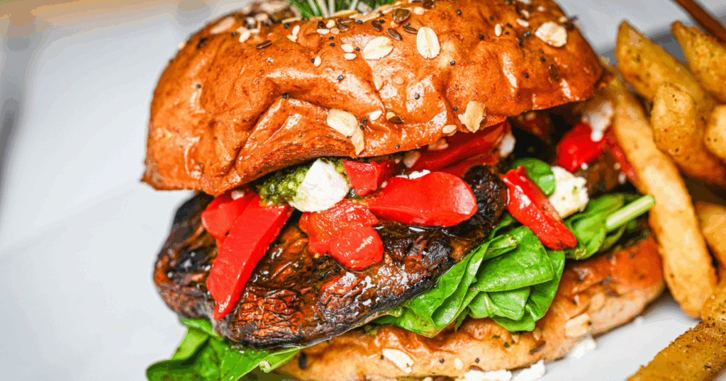  Crispy hand-hammered pork tenderloin sandwich with pickles, red onion, ketchup, and seeded bun at Hash House A Go Go in Las Vegas