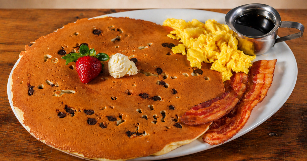 Oversized chocolate chip breakfast with scrambled eggs, crispy bacon, butter and syrup at Hash House A Go Go West Sahara Las Vegas